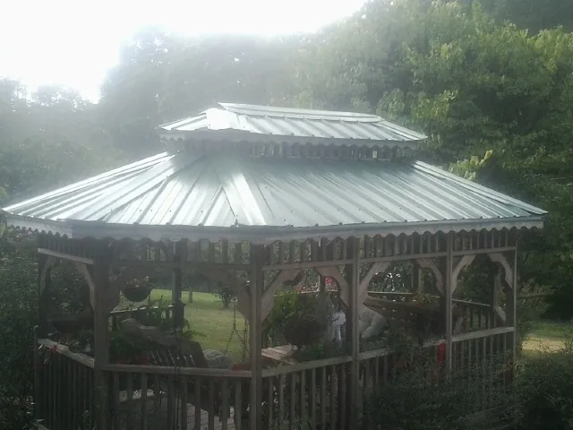 Two tier green metal roof on a garden gazebo in Wood Lake